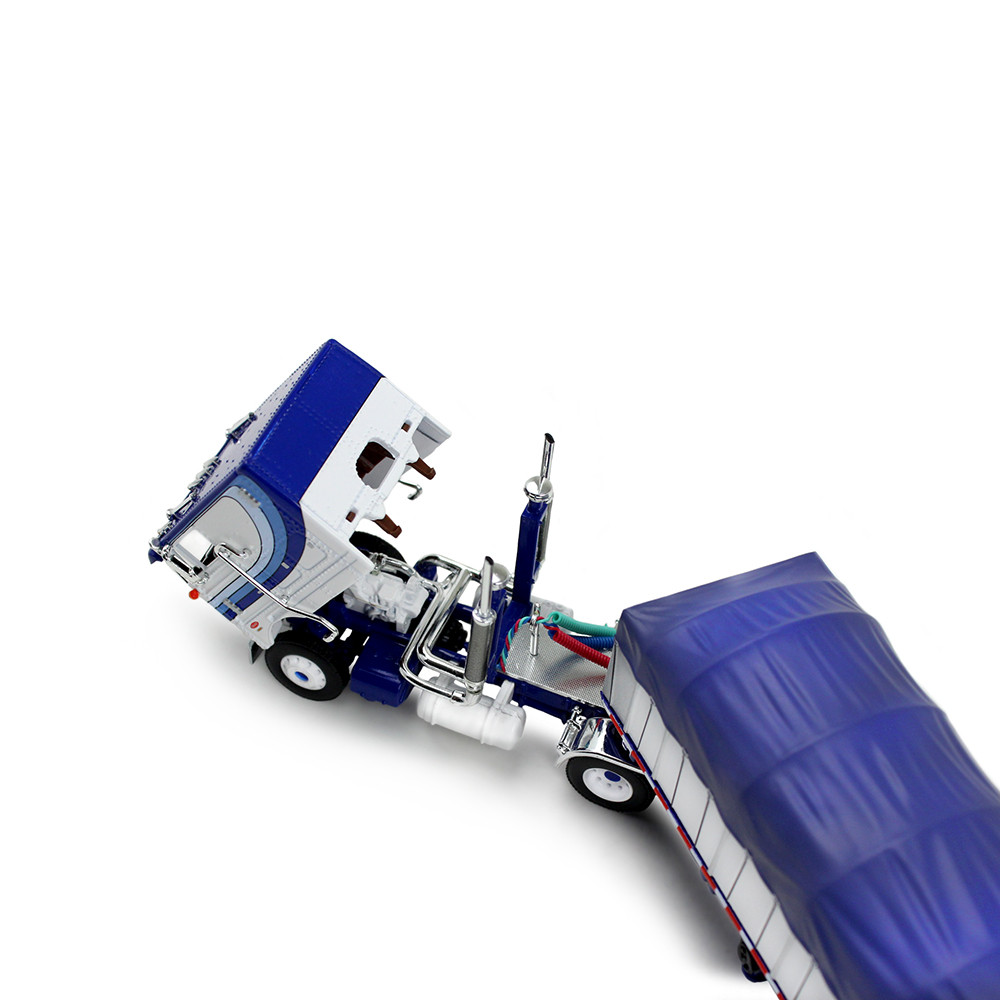 White/Blue Peterbilt Model 352 COE 110" Sleeper & 53' Wilson Roadbrute Flatbed Trailer with Covered Wagon