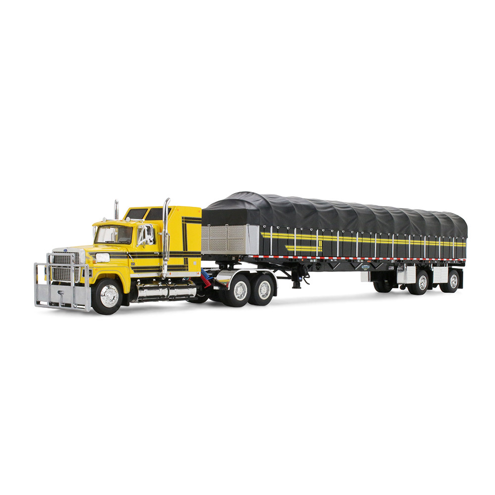 Yellow/Black Ford LTL 9000 with 60" Aerodyne Sleeper & 53' Wilson Roadbrute Flatbed Trailer with Covered Wagon