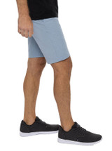 Travis Mathew Beck Short Blue with legs side.png