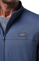 Travis Mathew Wanderlust Vest Mood Indigo Badge.png