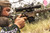Hunter shooting a rifle built on the MDT DRT Chassis System in FDE