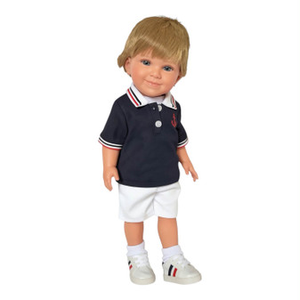 Caden, an 18-inch all-vinyl Kennedy and Friends boy doll with blonde hair, wearing a navy nautical polo with an embroidered anchor, white shorts and sneakers.