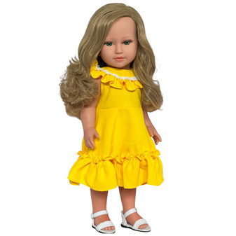 18 inch Kennedy and Friends doll named Sutton with long blonde hair and green eyes, wearing a yellow ruffle dress with white lace trim and white sandals. European-made fashion doll for collectors and imaginative play.