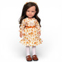 Lorelei and Friends Lourdes 12-inch fashion doll with long wavy dark brown hair, brown eyes, autumn pumpkin-print dress, orange bow, white tights, and brown Mary Jane shoes.