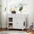 5 Star Pets Elite Hidden Washroom Storage Credenza in a white finish, styled next to a bright window with a tabby cat eating from a blue bowl on the floor nearby.