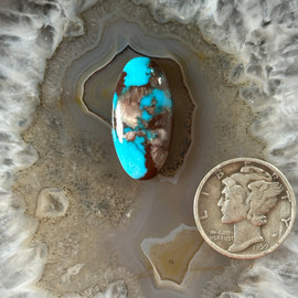 A Blue Bisbee with Quartz Gem Cabochon A Blue Bisbee with Quartz Gem Cabochon