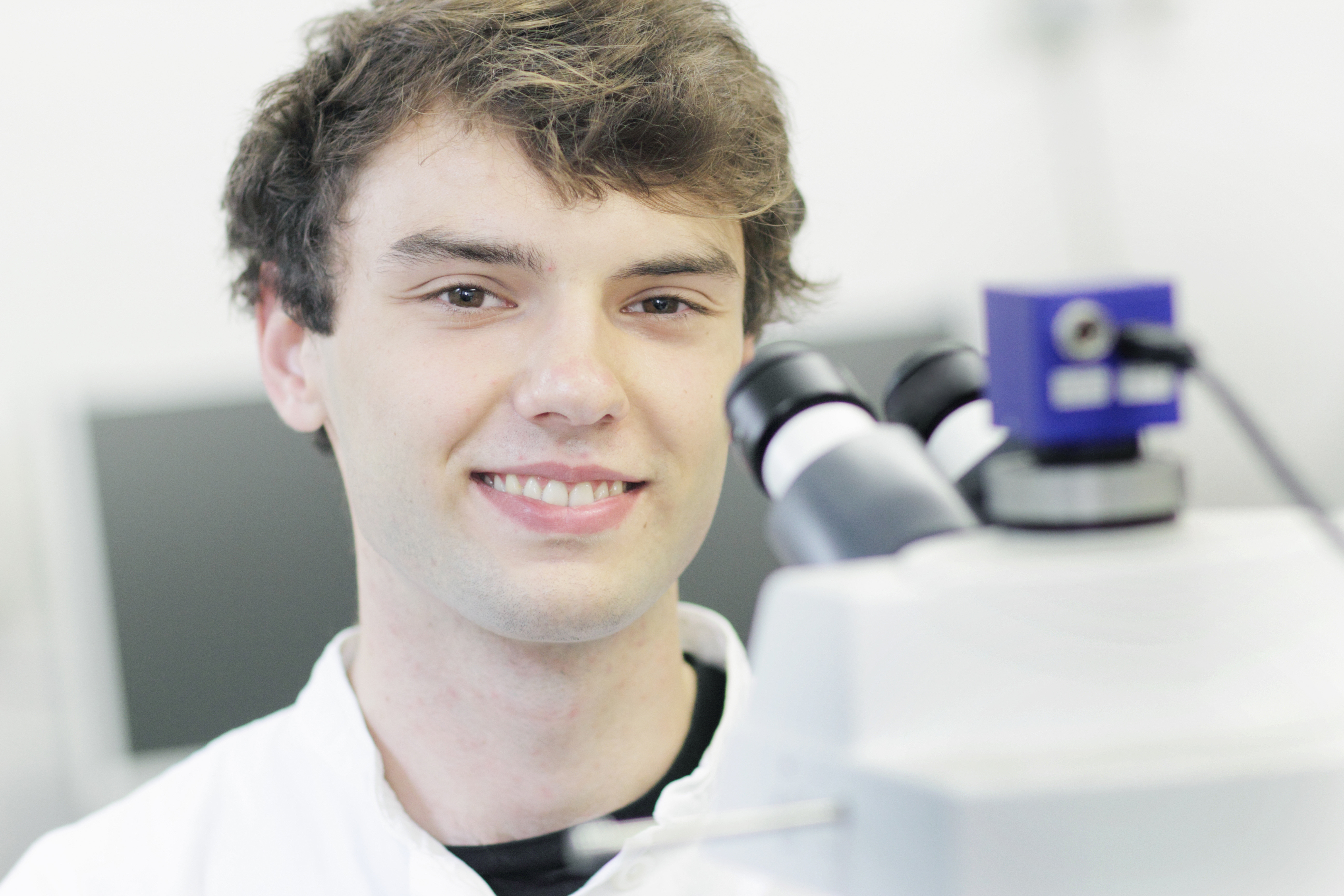 scientist-standing-at-microscope-in-lab-2021-11-17-18-25-56-utc.jpg