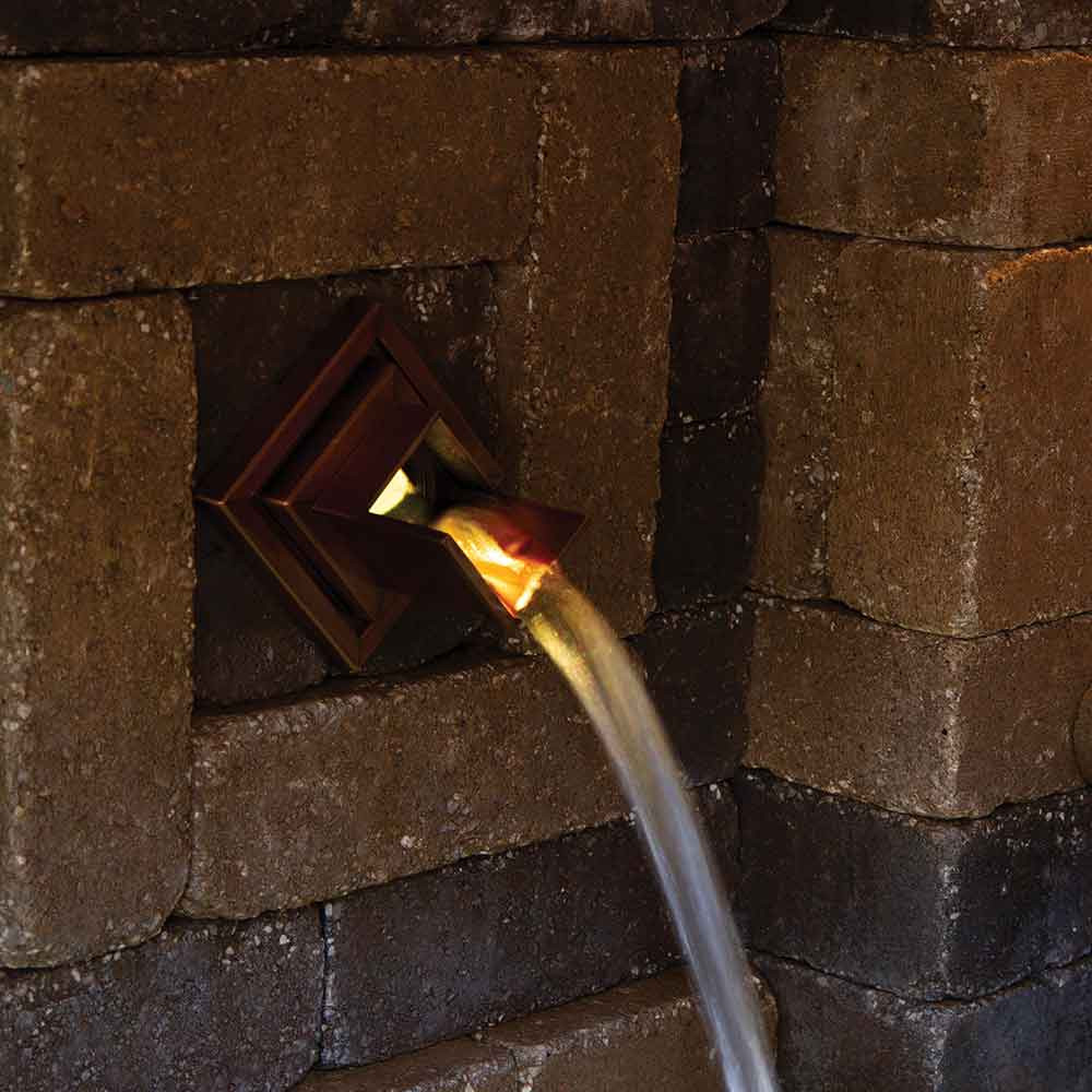 Atlantic Warm White Wall Spout Light in Hardscape Wall