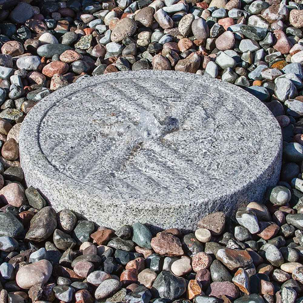 Blue Thumb Angled Millstone Fountain Kit Shown With Mixed Pebbles