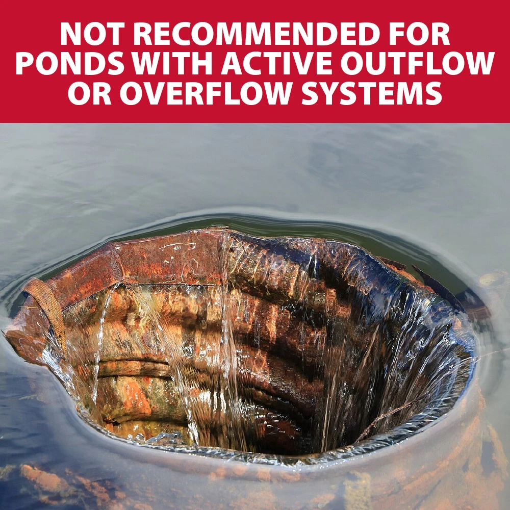Pond drain or overflow pipe with water flowing out, illustrating that pond dye is not recommended for ponds with active outflow or overflow systems.