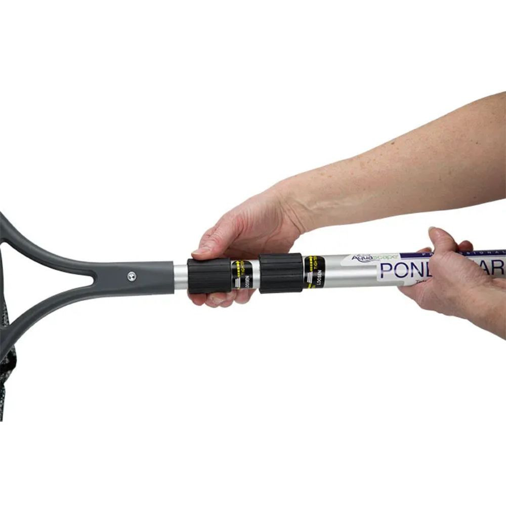 Hands adjusting twist-lock collars on Aquascape Pond Shark Pro’s aluminum telescoping handle.