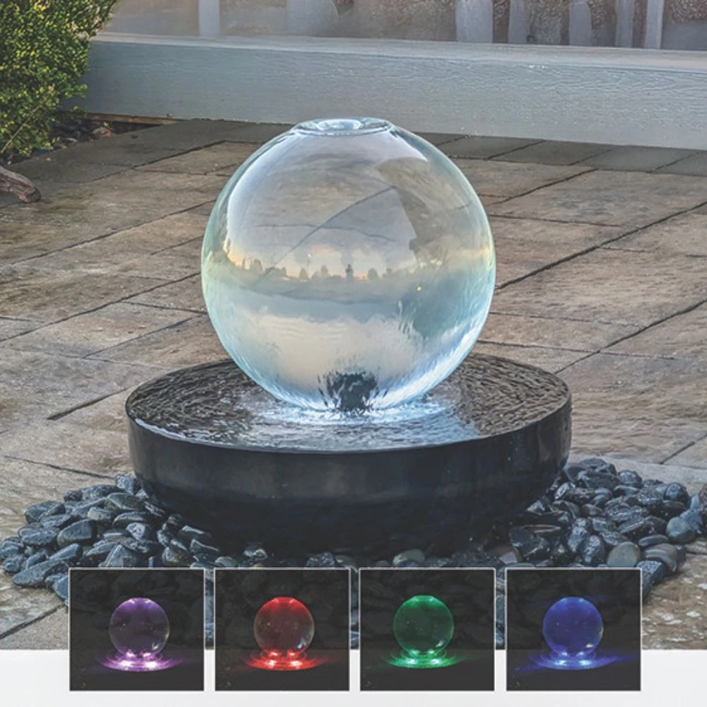 Blue Thumb crystal sphere fountain shown with integrated LED lighting, featuring color-changing illumination options displayed beneath the flowing water feature.