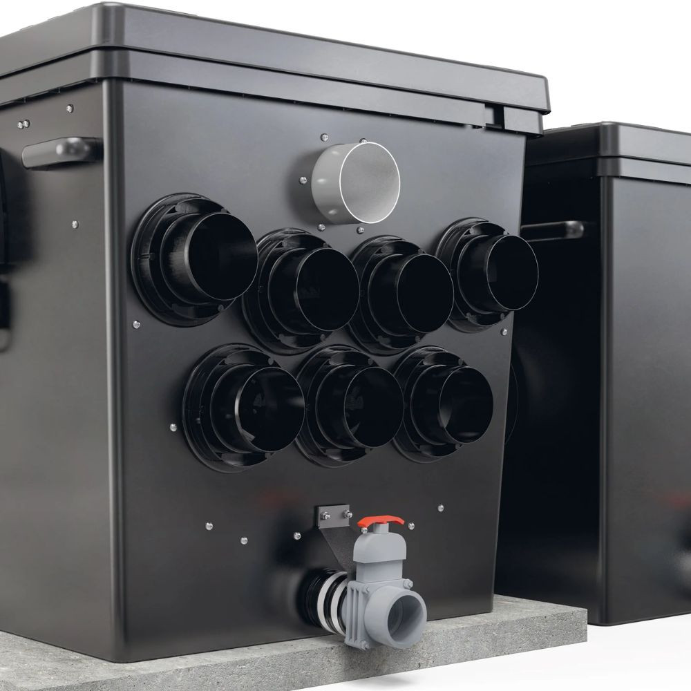 Side view of Oase ProfiClear Premium XL gravity-fed pond filter showing multiple DN inlets, outlet port and bottom sludge drain valve for easy maintenance