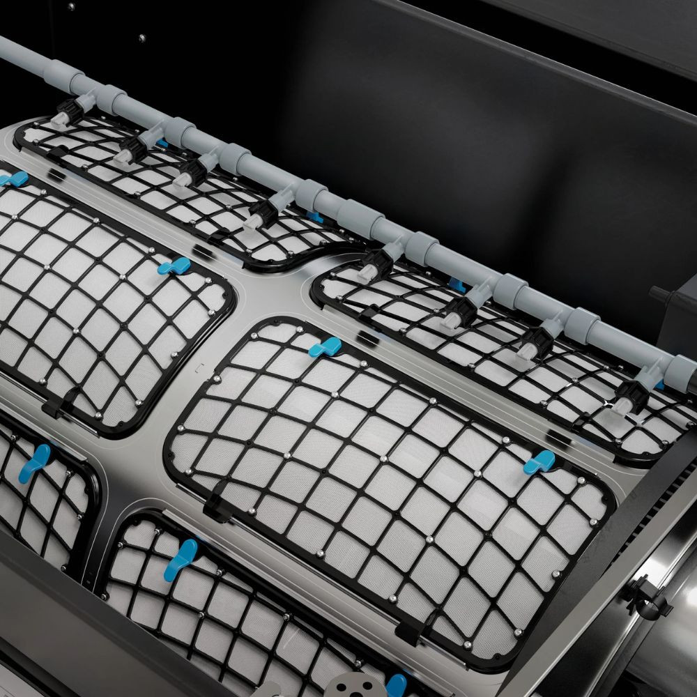 Close-up of Oase ProfiClear Premium XL rotary drum screen with 60 micron mesh and automatic spray bar for precision mechanical filtration