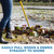 Jenlis Weed Raker pulling lily pads, weeds, and debris from shallow pond water directly onto the shoreline. View Product Image
