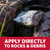 Oxy-Lift Defense granules on an algae-covered rock with the bottom text “Apply Directly to Rocks & Debris”. View Product Image