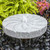 Blue Thumb Raised Swirl Millstone Fountain Shown With Black Pebble Option View Product Image