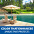 Clear blue pond beside a lakeside deck with chairs and umbrella, representing enhanced pond color and shaded water in a landscaped setting. View Product Image