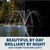 Split image of fountain display during day and illuminated at night with arcing water patterns highlighting optional RGBW lighting upgrade View Product Image