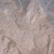 Close-up of DekoRRa’s Riverbed faux rock texture, showing an earthy blend of brown and gray tones for natural-looking outdoor coverage. View Product Image