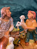 Callum seated shepherd father with Leo shepherd boy holding sheep Fontanini figures