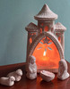 Bangladesh terracotta nativity displayed inside an openwork stable designed for a battery-operated tealight