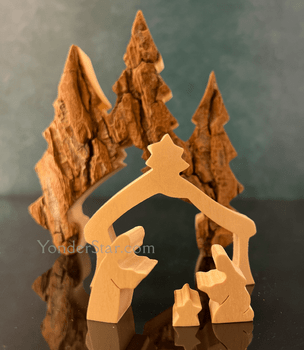 Handmade Polish wooden nativity with bark evergreen trees
