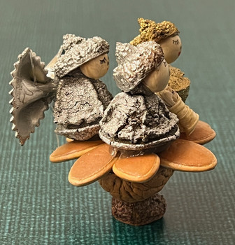 Folk-art manger scene from Ecuador featuring the Holy Family created with natural seeds, pods, and corn husk on a walnut shell.