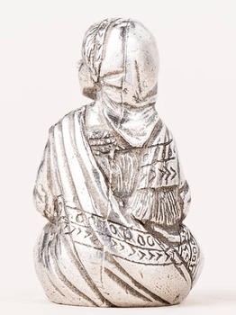 Danforth villager girl seated