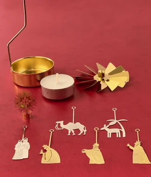 Gold and silver Nativity candle spinner shown disassembled with hanging figures and tealight