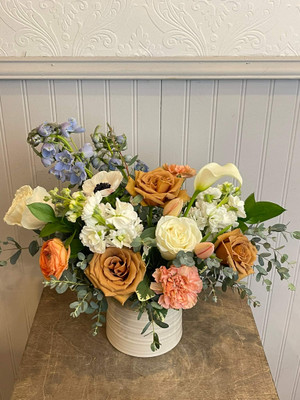 Hugs

Ethereal beige roses called 'toffee' are combined with white stock and roses, peach carnations and ranunculus, tulips and pale blue bella donna to create this vintage feeling arrangement. Our pottery pot is a glazed cream color with an unglazed darker rim. It comes in one size pot so choose your price range and we will fill to order. Make it extra special by adding a candle + matches, chocolates and wine!

Seattle flower delivery by Juniper Flowers

Due to changes in season, weather, and availability we reserve the right to make substitutions in flowers for your order. Our photos are a GUIDE to our designs.
