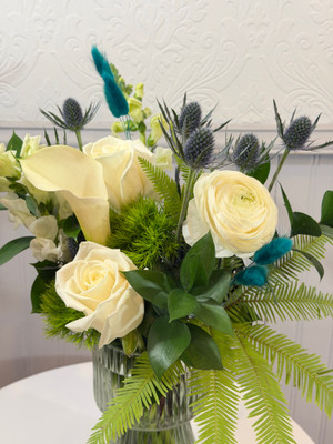 March Birth Month Floral

March's gemstone is Aquamarine. We portray that watery mix of blue and green with an aqua colored translucent vase, white calla, roses and snapdragons, blue thistle and a hint of wispy turquoise bunny tail tufts. A perfect start to Spring!

NOVEMBER:golden topaz or citrine, DECEMBER:Blue Zircon, Blue Topaz, or Tanzanite JANUARY:Garnet,  FEBRUARY:Amethyst, MARCH:Aquamarine, APRIL:Diamond, MAY:Emerald, JUNE:Alexandrite or Pearl, JULY:Ruby, AUGUST:Peridot or Spinel, SEPTEMBER:Sapphire, OCTOBER:Tourmaline or Opal

Designer Tip: pair this floral with Kundalini Candle and our boxed matches for a stylish look!

Seattle flower delivery by Juniper Flowers

Due to changes in season, weather, and availability we reserve the right to make substitutions in flowers for your order. Our photos are a GUIDE to our designs.