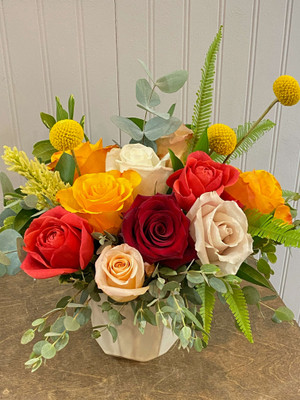 Catalina Rose Cluster  Our favorite geometric vase filled with our favorite roses. Accents of various green foliage and grasses, this is a fun floral for any occasion. Seattle flower delivery by Juniper Flowers