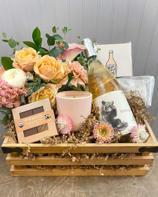 Rosé Gift Crate
This lovely gift crate is all blush all day! Included is a pretty floral in pale pinks, creamy white and blush tones. Along with Blushing Bear Rosé from the winery of Kyle MacLachlan's Pursued by Bear, Blush toned Kundalini Candle in sea salt and honeydew scent, a lavender/flax relaxing eye pillow, Fran's Chocolates thins and our Rosé All Day Letterpress card from Seattle's Dahlia Press. This crate works for so many occasions such as birthday, anniversary, cheering up, or as a fun bridesmaid gift. 
Seattle Flower and gift crate delivery by Juniper Flowers