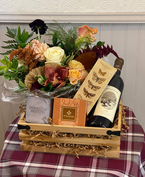 Fall Holiday Gift Crate

This fall inspired gift crate is a perfect addition to the holiday! Bring it as a host gift for the friend or family member doing all the work! Included is a kundalini candle, boxed matches, floral arrangement, 12 piece box of Fran's milk and dark chocolate caramels, table runner measuring 82" long/ 18" wide and your choice of wine.

Due to changes in season, weather, and availability we reserve the right to make substitutions in flowers for your order. Our photos are a GUIDE to our designs.

Must be 21 to purchase.

Recipient must be 21+ years of age with i.d.

We will contact the recipient for a delivery window, so recipients phone number must be included with the order.

If picking up, must show proof of age at time of pickup.