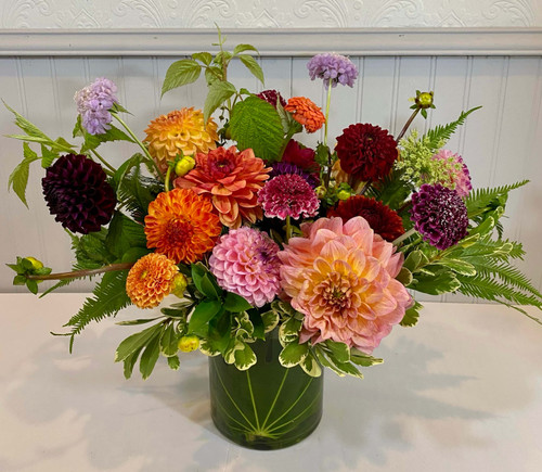 Dahlia Desktop Seasonal is best! We shop local and have so many beautiful dahlia varieties available from the local growers. Choose this floral for an assortment of dahlias and more for your desk or kitchen table. We pick the best colors of the day for you. Seattle flower delivery by Juniper Flowers