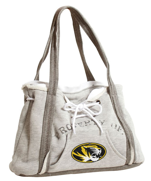 How about a bag that looks and feels like your favorite hoodie sweatshirt? The hoodie purse is just that! This purse features metal grommets, hoodie lacing, a working kangaroo pocket, white ribbing and zig-zag stitching. It measures 15.5" in length, 4" in width, and 9.75" in height. Made By Little Earth