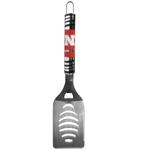 The tailgater spatula really catches your eye with flashy chrome accents and vivid digital graphics. The 420 grade stainless steel spatula is a tough, heavy-duty tool that will last through years of tailgating fun. The spatula features a bottle opener and sharp serrated edge. Made by Siskiyou Gifts.