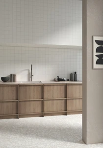 Typic reimagines traditional handcrafted ceramic wall tiles in a compact 100x100mm format. This glazed, gloss-finish wall tile has a gently uneven surface, so light pools and shifts across every piece. White sits at the cool, bright end of the palette, a clean architectural tone that bounces light around a room and keeps small spaces feeling open, airy and easy to style around. A gloss wall tile for kitchens, hospitality spaces and feature walls, Typic White can be laid in a grid or brick-set pattern to play up its handmade character.