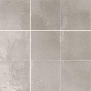 Typic reimagines traditional handcrafted ceramic wall tiles in a compact 100x100mm format. This glazed, gloss-finish wall tile has a gently uneven surface, so light pools and shifts across every piece. Grey anchors the neutral end of the collection with a cool, architectural finish, well suited to spaces that lean minimalist, industrial or quietly contemporary. A gloss wall tile for kitchens, bathrooms, hospitality spaces and feature walls, Typic Grey can be laid in a grid or brick-set pattern to play up its handmade character.