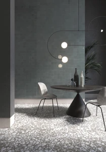 Typic reimagines traditional handcrafted ceramic wall tiles in a compact 100x100mm format. This glazed, gloss-finish wall tile has a gently uneven surface, so light pools and shifts across every piece. Graphite offers a softer alternative to black, a dark charcoal tone with real depth that still reads as bold without feeling quite as heavy in a room. A gloss wall tile for kitchens, hospitality spaces and feature walls, Typic Graphite can be laid in a grid or brick-set pattern to play up its handmade character.