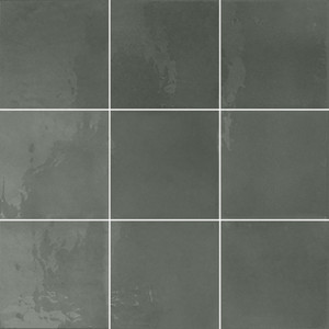 Typic reimagines traditional handcrafted ceramic wall tiles in a compact 100x100mm format. This glazed, gloss-finish wall tile has a gently uneven surface, so light pools and shifts across every piece. Graphite offers a softer alternative to black, a dark charcoal tone with real depth that still reads as bold without feeling quite as heavy in a room. A gloss wall tile for kitchens, bathrooms, hospitality spaces and feature walls, Typic Graphite can be laid in a grid or brick-set pattern to play up its handmade character.