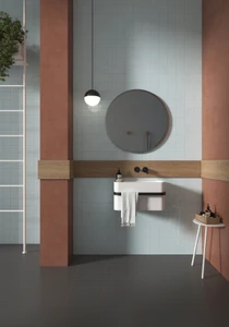 Typic reimagines traditional handcrafted ceramic wall tiles in a compact 100x100mm format. This glazed, gloss-finish wall tile has a gently uneven surface, so light pools and shifts across every piece.Azure is the collection's only true cool colour, a clear wash of blue that lifts a scheme and brings a fresh, coastal note among the earthier tones.A gloss wall tile for kitchens, bathrooms, hospitality spaces and feature walls, Typic Azure can be laid in a grid or brick-set pattern to play up its handmade character.