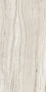 Astral Pearl Polished draws on the pale, layered beauty of directional onyx, with soft ivory, warm grey and taupe veining set into a 600x1200mm porcelain tile with a reflective, light finish. Fine linear streaks move gently through a soft white base, shifting between cream, pale grey and mother-of-pearl tones in a calm, flowing rhythm that feels light, airy and effortlessly elegant. The polished surface adds a gentle sheen that lifts natural light, making Pearl a versatile choice for bathrooms, kitchens and feature walls in soft, light or neutral colour schemes overall.