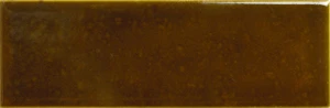 Amarcord Tabacco channels the deep, smoky brown of cured tobacco leaf, a moody earthy tone with subtle olive undertones running through its glaze. The tile's glossy finish softens into shadow and light across its surface, giving walls a rich, layered texture rather than a single flat colour. Tabacco works well on feature walls, hallways and hospitality interiors looking for a grounded, atmospheric backdrop with genuine depth.