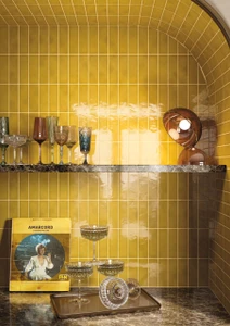 Amarcord Miele glows with the warmth of aged honey, a soft golden hue that shifts gently across every 50x150mm porcelain tile, echoing the sun-washed interiors of a bygone Italian summer. The gloss glaze holds light unevenly across its surface, creating quiet variation from tile to tile so no two panels of wall look quite the same. Warm and inviting, Miele suits bathroom walls, splashbacks and feature walls where a golden glow adds character without overwhelming the space.