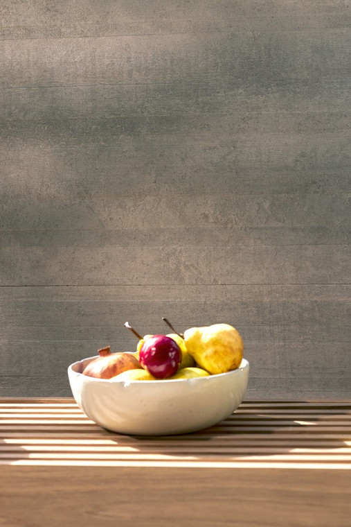 Inspired by Brutalist architecture, Sintese Platina Brutalista Deco Matt translates the raw honesty of concrete into a sculptural, three-dimensional surface with subtle rust-toned flecks. The 600x1200mm matt decorative panel introduces relief and shadow play across the wall, adding tactile depth that a flat tile simply can't achieve on its own. Best used as a feature wall in living areas, entries or commercial interiors, it pairs naturally with the flat Sintese Platina tiles for a considered, layered finish.
