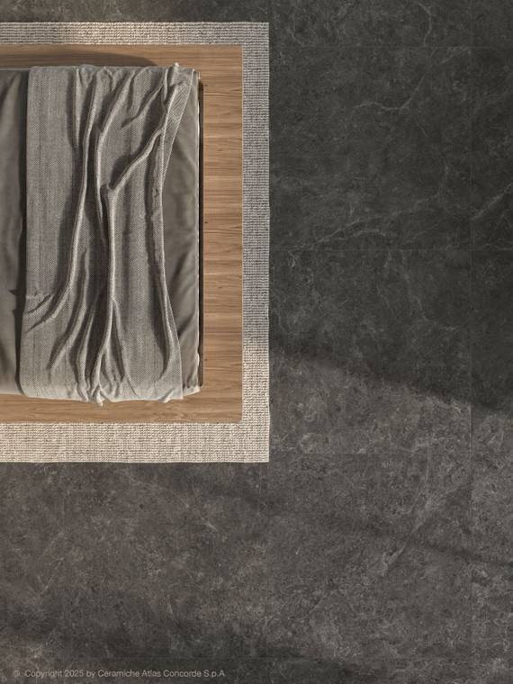 Nyra Charcoal delivers a deep, dark grey tone with soft, natural veining, giving the 600x1200mm matt porcelain tile a bold yet understated stone-effect presence. Guided by a considered design narrative, Charcoal reinterprets stone through texture and tonal depth rather than direct imitation, resulting in a considered, moody finish. Charcoal suits feature walls, bathroom floors and kitchen splashbacks, adding contrast and drama within industrial, contemporary and luxury interior design styles.