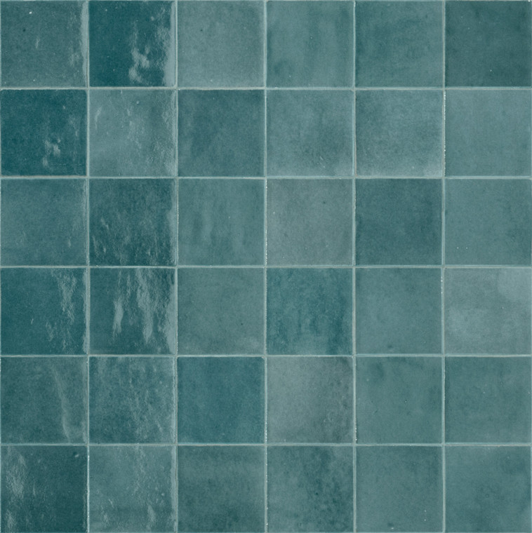 Melange Acquamarina brings a fresh, blue-toned colourway into the Melange range, evoking the shifting shades of the sea. Significant variation in texture, pattern and colour across each tile creates a surface with real depth and movement, as tones shift from piece to piece rather than repeating flatly across the wall. The 100x100mm format holds a broadly regular shape, while irregular edges introduce a soft, tactile texture well suited to more artisan-inspired interiors. A glossy glaze finishes the surface, reflecting light and enhancing the clarity and vibrancy of the blue tones for a fresh, graphic result. It's a striking option for anyone after blue feature wall tiles or bathroom tiles with genuine chromatic intensity, and at Tile Space we recommend it for New Zealand homes wanting a distinctive, coastal-inspired atmosphere in smaller, personal spaces.