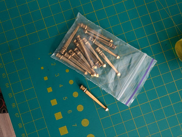 Hand-braided cord with brass tip